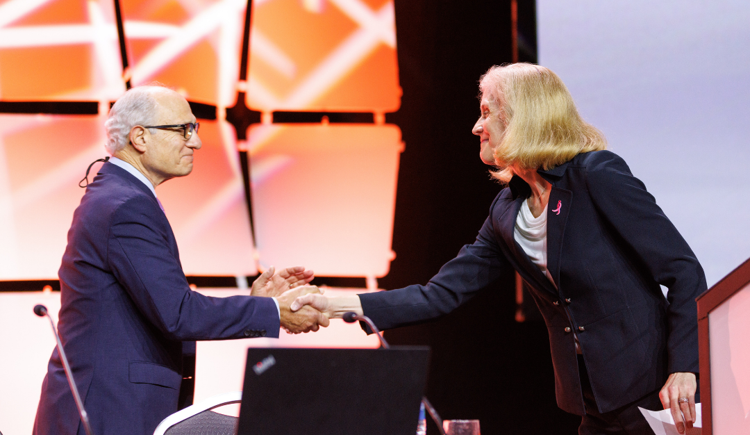 dr. geoffrey wahl shakes hands with another researcher before receiving his brinker award at sabcs