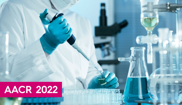 a lab worker uses equipment wearing blue gloves and wearing a white lab coat