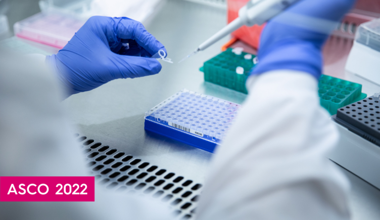 a lab worker wearing blue gloves prepares a sample