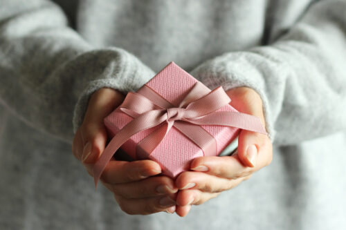 gift box in female hands. Holiday, give, gift. High quality photo