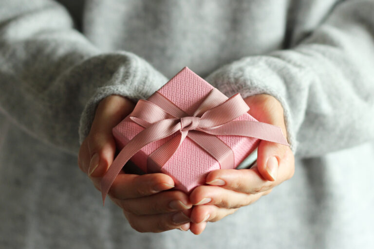 gift box in female hands. Holiday, give, gift. High quality photo