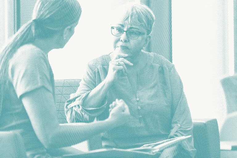 an older woman speaks with her doctor
