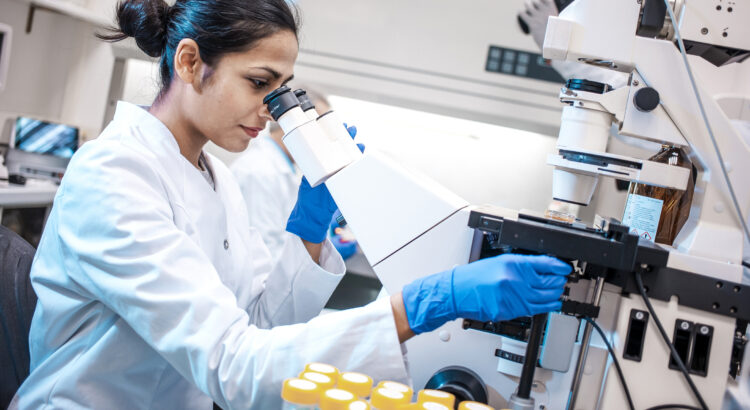 Female Scientist Working in The Lab, Using Microscope
