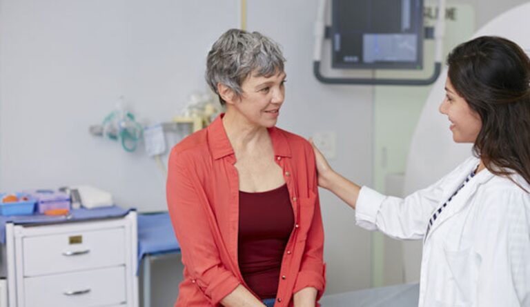 doctor with hand on patient's shoulder