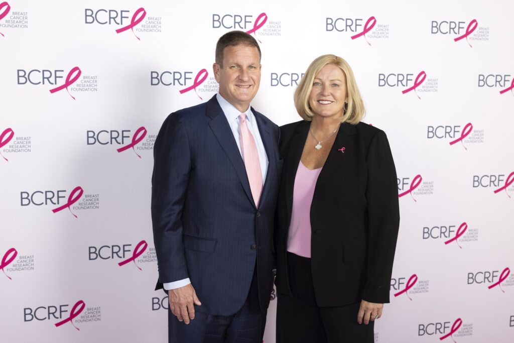 karen and rob hale standing in front of BCRF signage